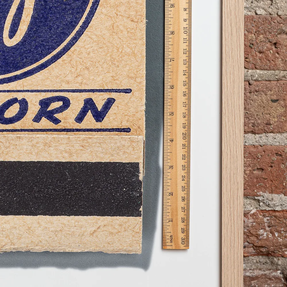 Jays Popcorn matchbook next to a framed print, for scale