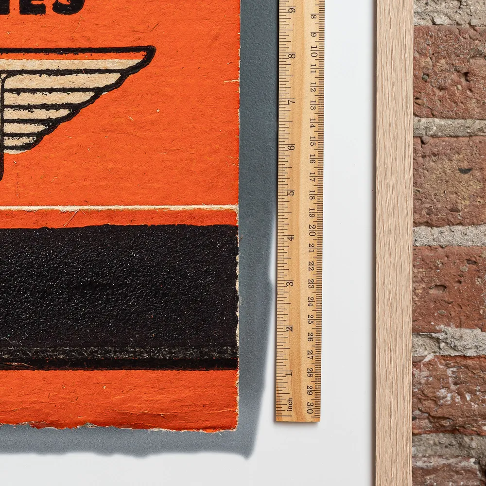 Chicago Airlines matchbook next to a framed print, for scale