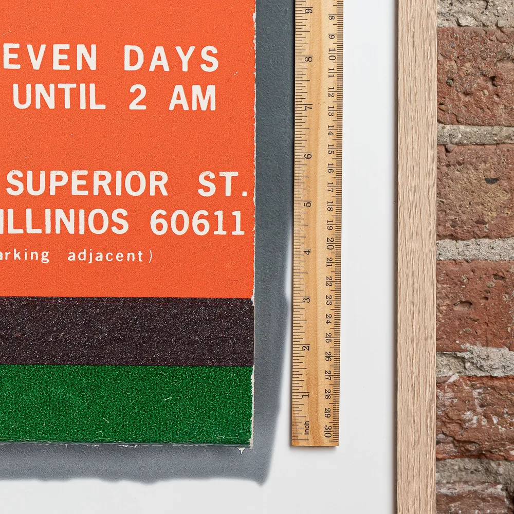 Gino's East matchbook next to a framed print, for scale